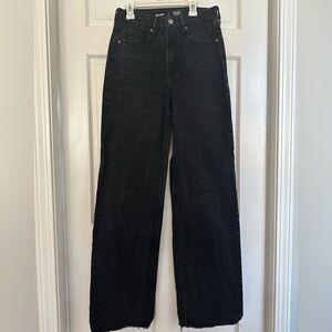 High waisted, extra long, wide-leg jeans with distressed cuffs. Very stylish!